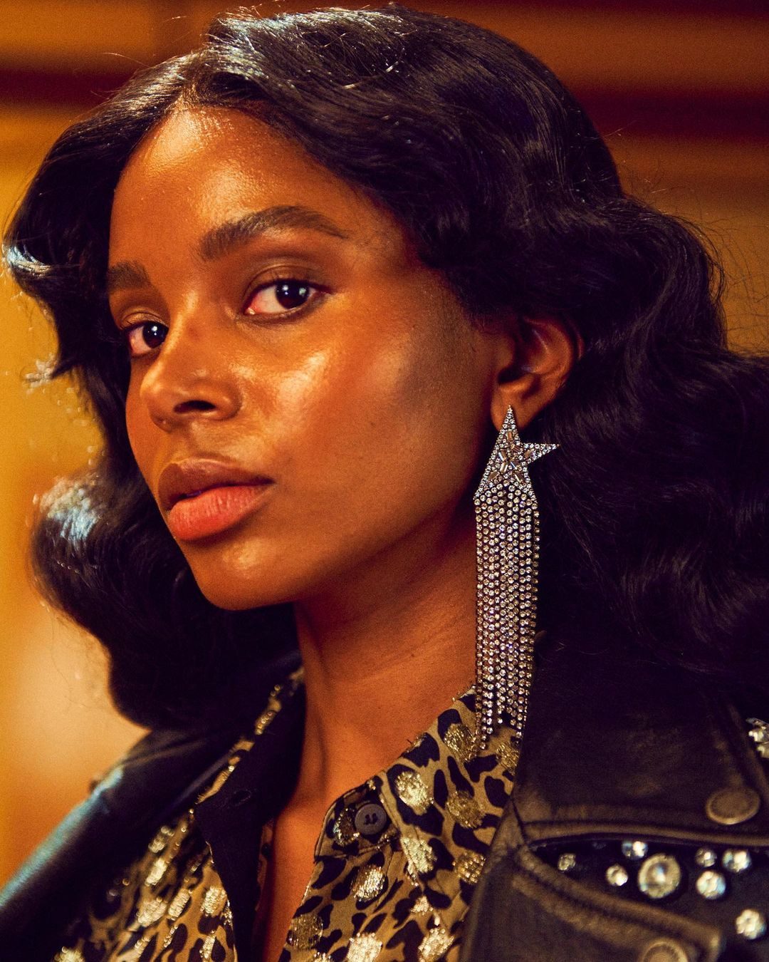 Close portrait of a woman in a studded leather jacket